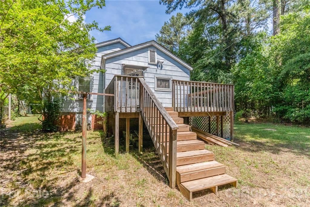 507 State Rd S-29-70 Lancaster, SC 29720 - Photo 27 of 27 a view of a house with a small yard and wooden fence