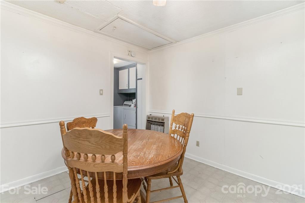 507 State Rd S-29-70 Lancaster, SC 29720 - Photo 7 of 27 a view of a dining room with furniture and wooden floor