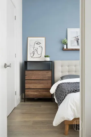 a kitchen with cabinets and chairs