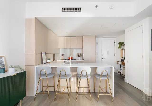 a kitchen with a sink cabinets and appliances