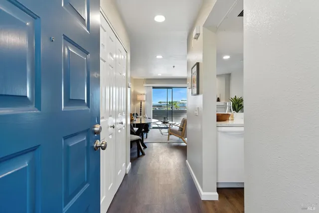 a view of living room with furniture and wooden floor
