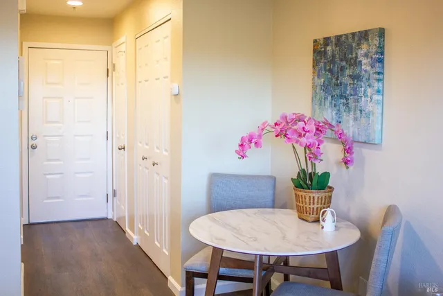 a view of a dining room with furniture and wooden floor