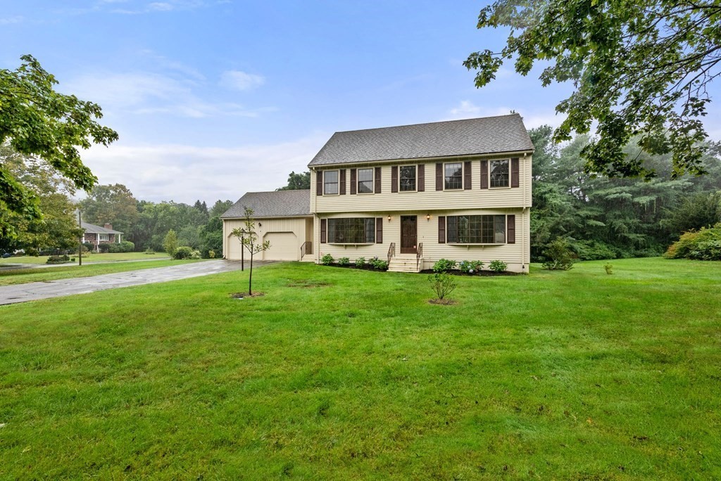 4 Woodpark Circle Lexington, MA 02421 - Photo 2 of 27 a view of a house with a big yard