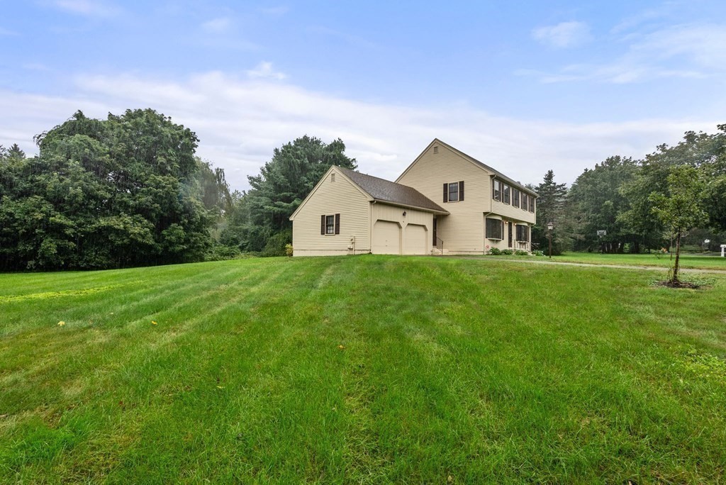 4 Woodpark Circle Lexington, MA 02421 - Photo 24 of 27 a house view with a garden space