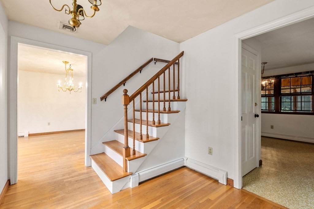 4 Woodpark Circle Lexington, MA 02421 - Photo 4 of 27 a view of an entryway with wooden floor