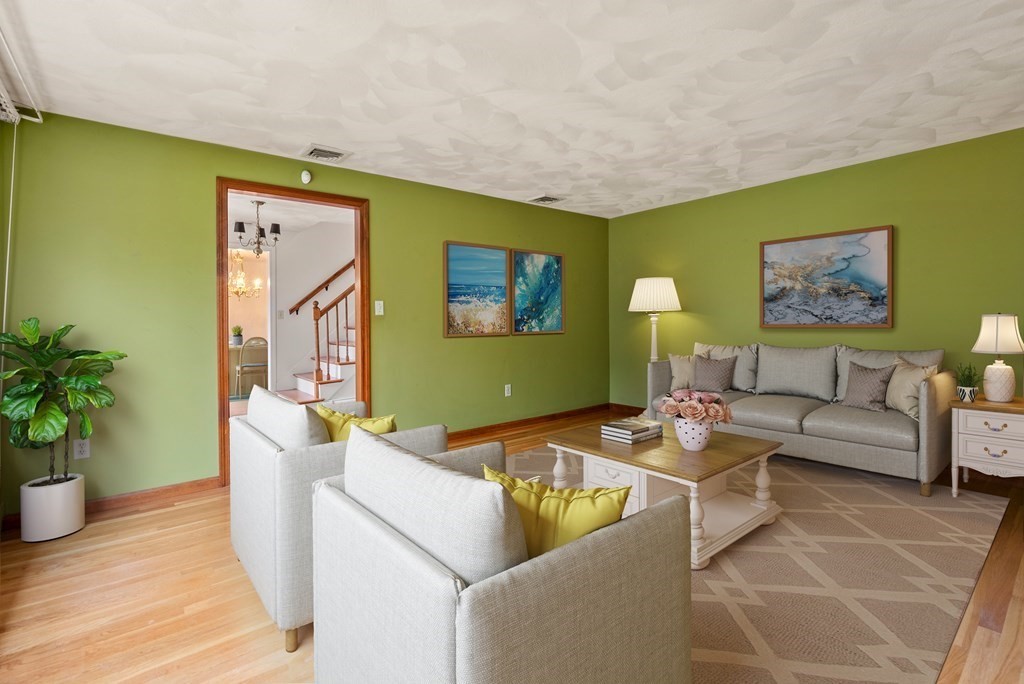 4 Woodpark Circle Lexington, MA 02421 - Photo 5 of 27 a living room with furniture and potted plant