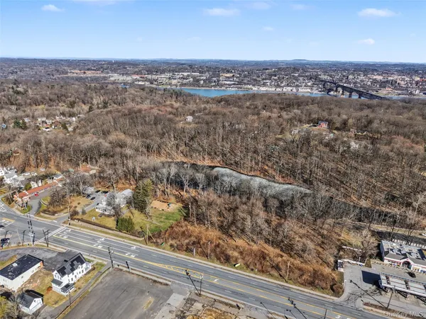 a view of residential houses with city and lake view