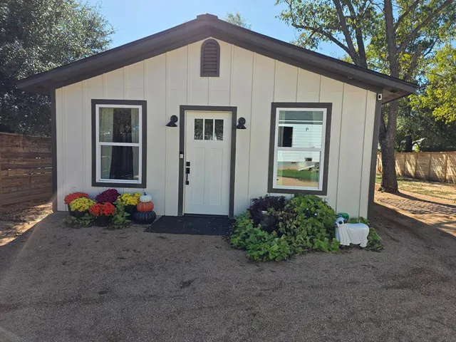 a front view of a house with an outdoor space