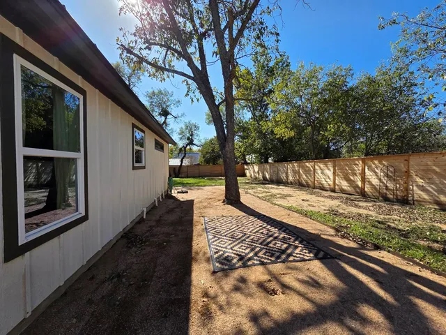 a view of a back yard of the house