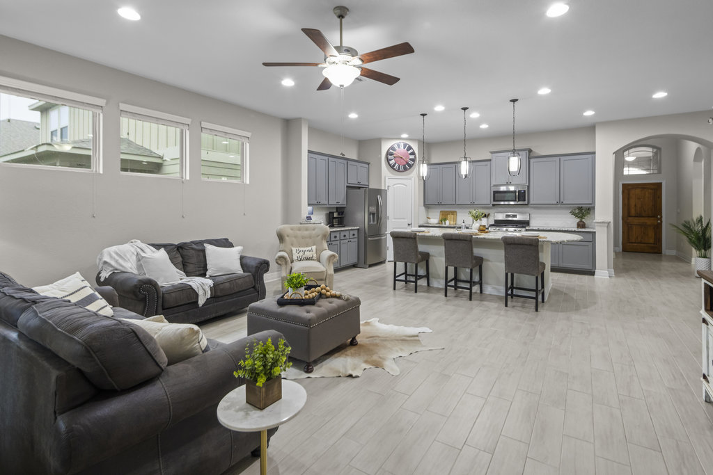 409 Bonnet Boulevard Georgetown, TX 78628 - Photo 1 of 1 a living room with furniture kitchen view and a chandelier