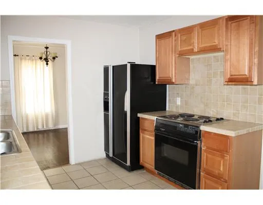 a kitchen with a stove microwave and refrigerator