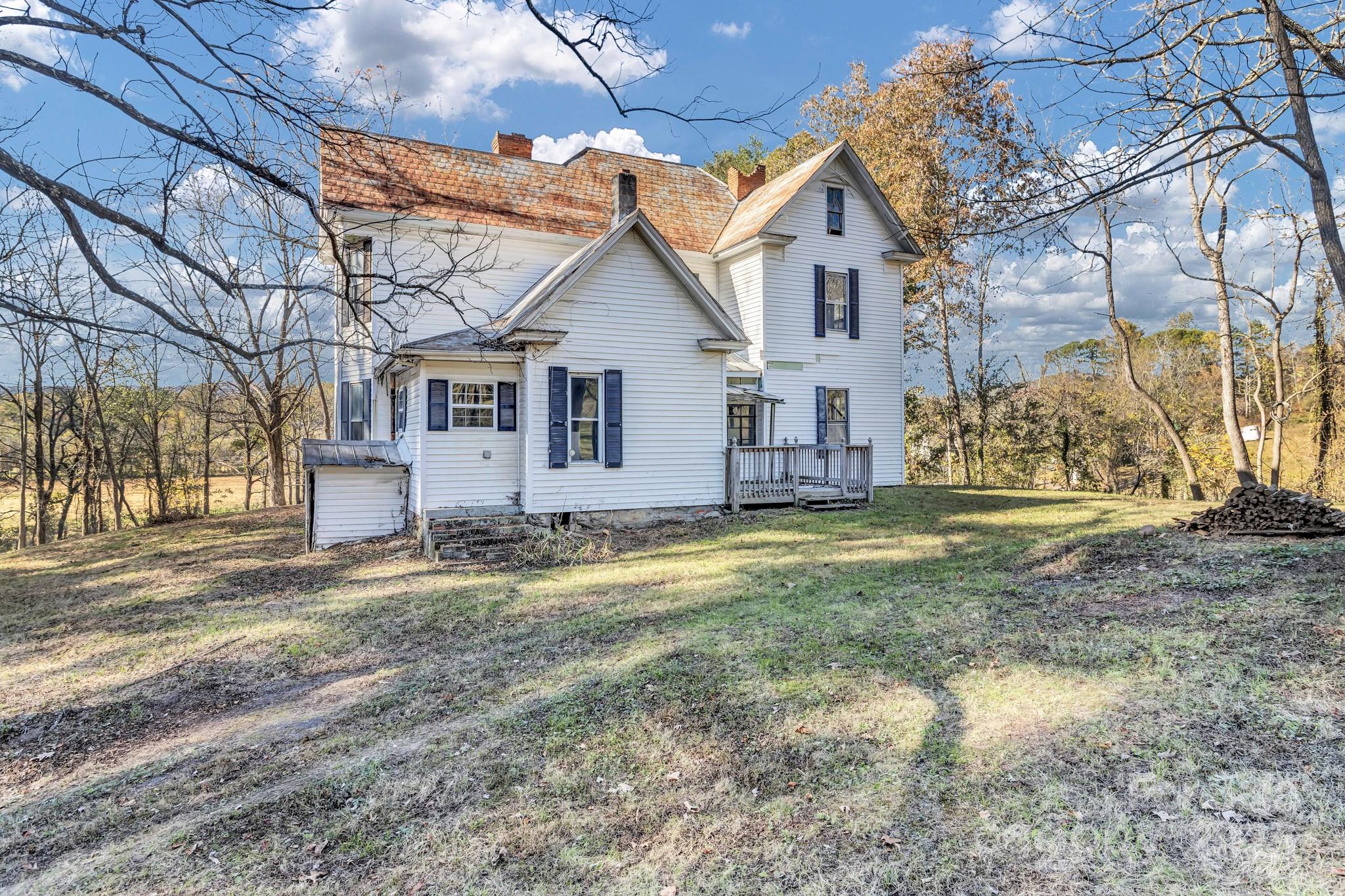 143 Sharon Road Fairview, NC 28730 - Photo 11 of 36 a view of a house with a yard