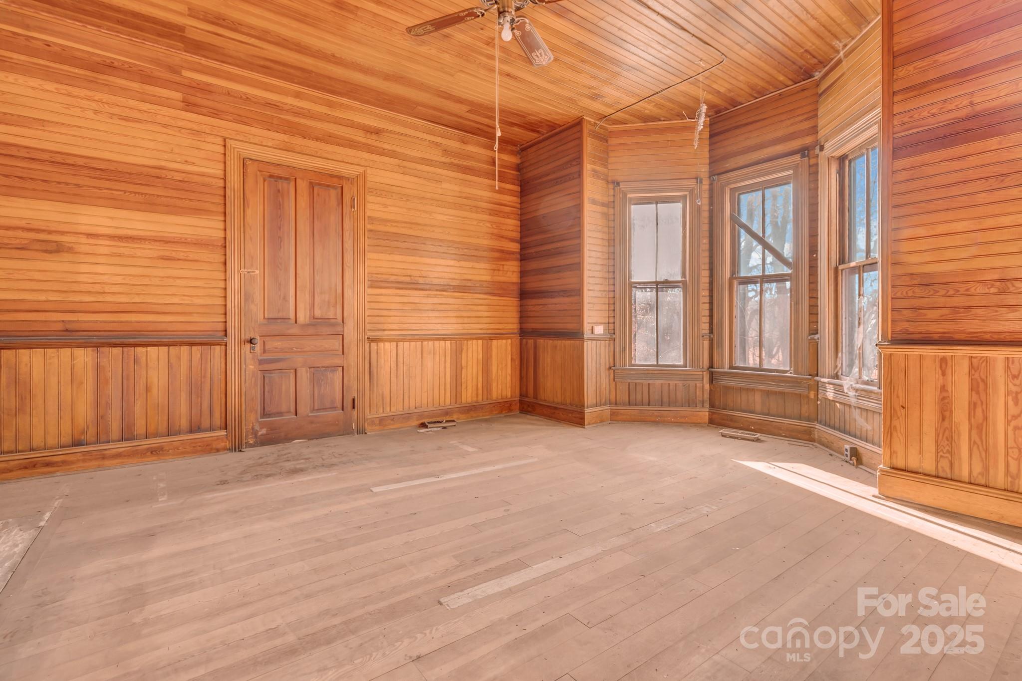 143 Sharon Road Fairview, NC 28730 - Photo 21 of 36 an empty room with windows