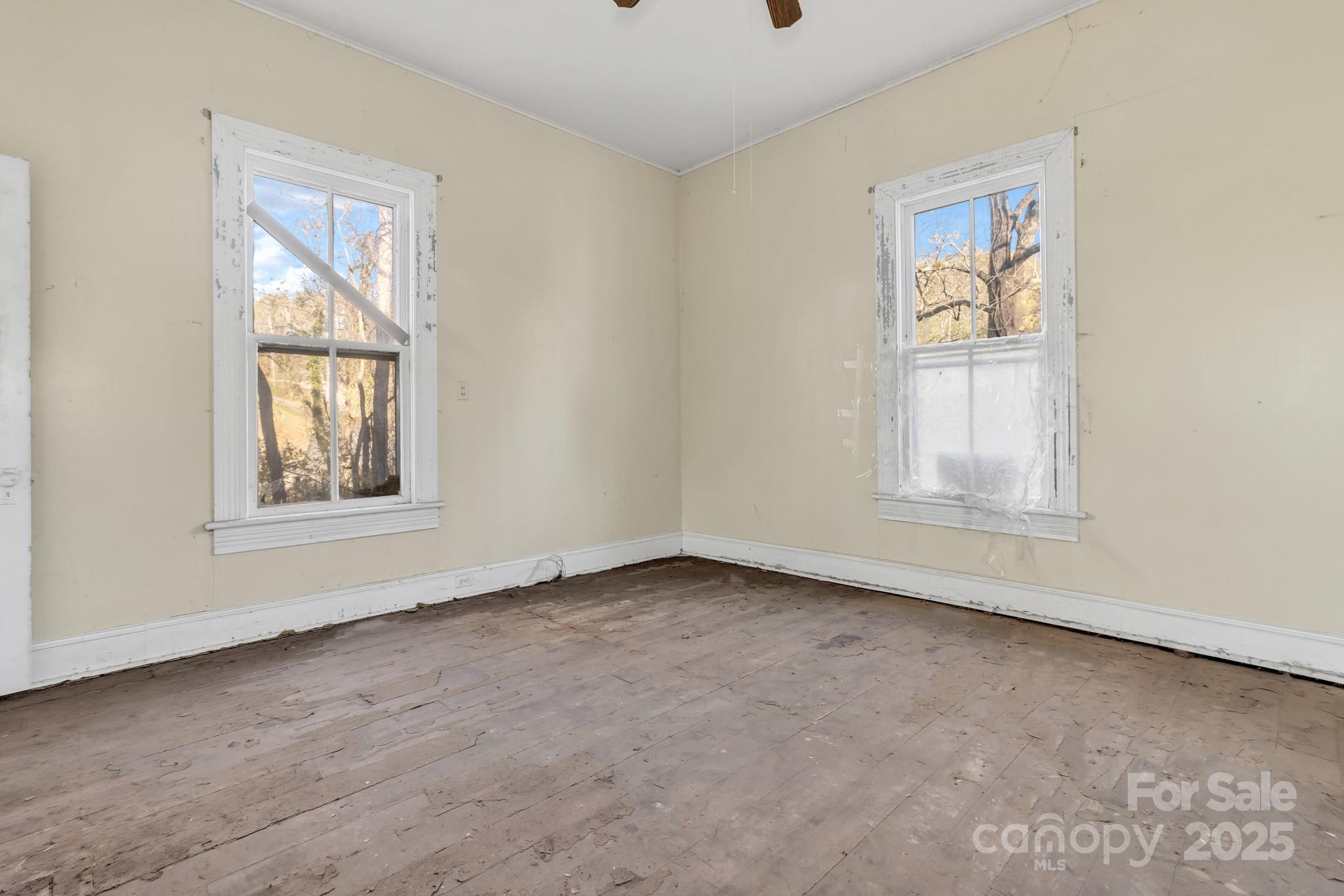 143 Sharon Road Fairview, NC 28730 - Photo 25 of 36 an empty room with windows