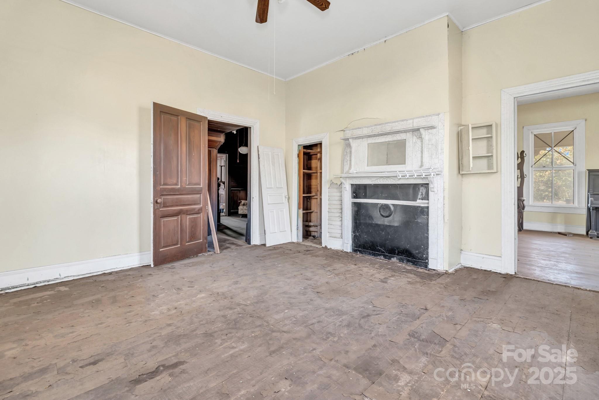 143 Sharon Road Fairview, NC 28730 - Photo 26 of 36 an empty room with closet and windows