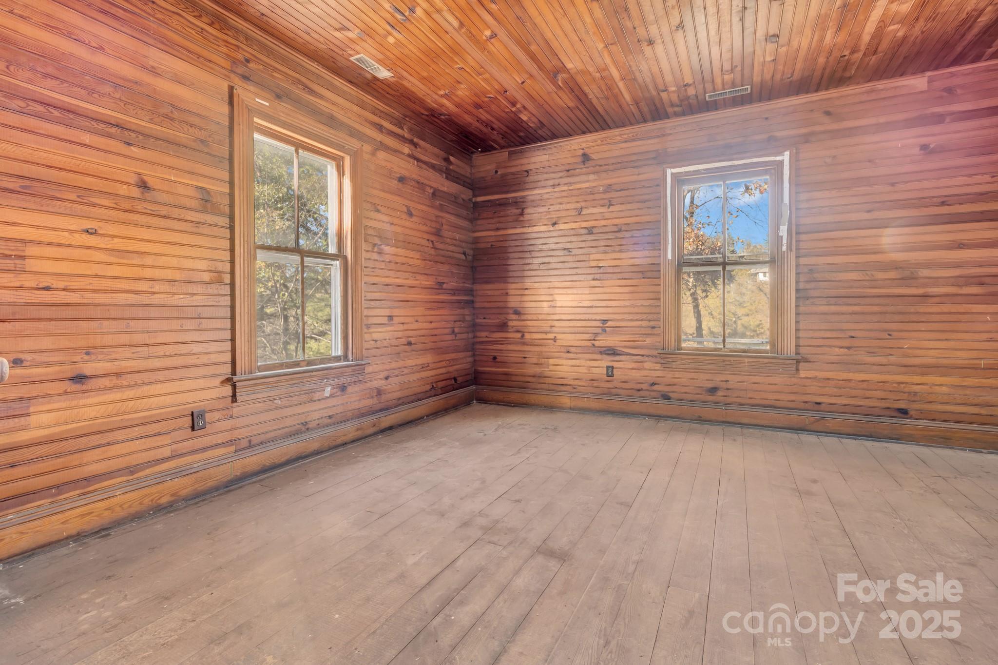 143 Sharon Road Fairview, NC 28730 - Photo 30 of 36 a view of an empty room with a window