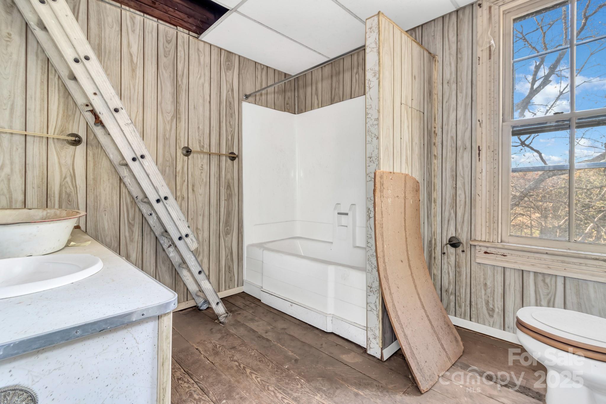 143 Sharon Road Fairview, NC 28730 - Photo 32 of 36 a bathroom with a sink a toilet and a shower