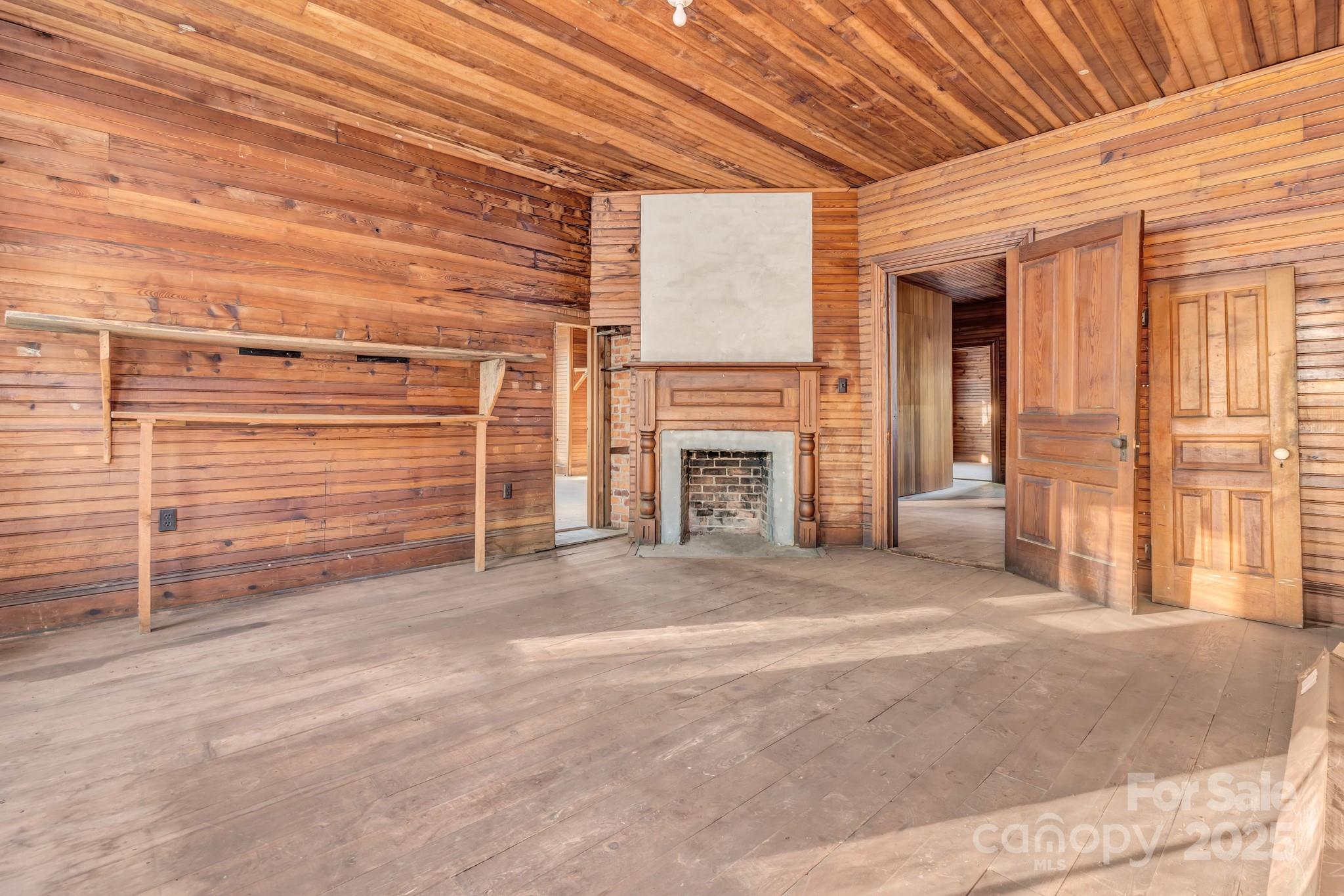 143 Sharon Road Fairview, NC 28730 - Photo 36 of 36 a view of an empty room with a fireplace
