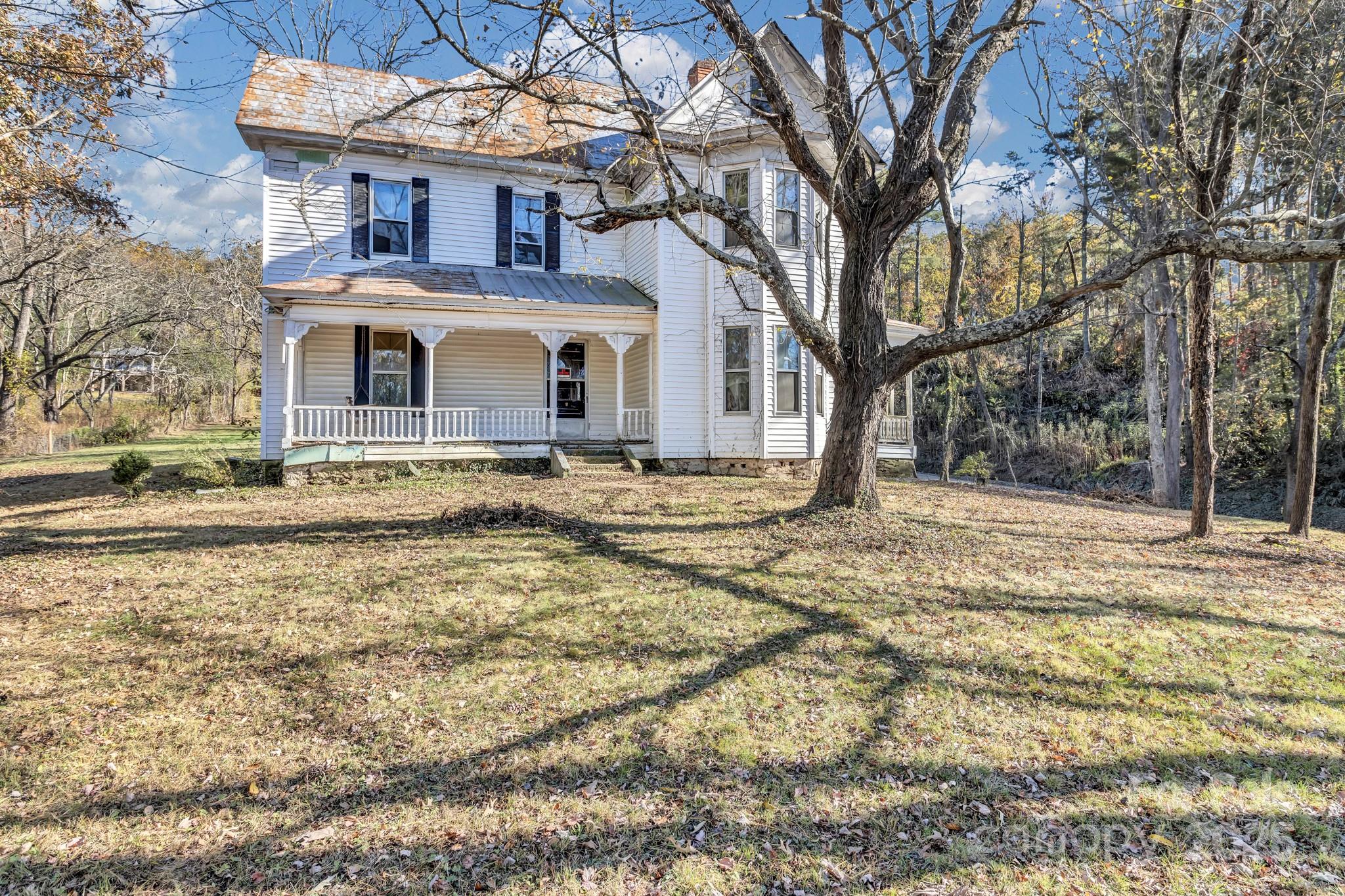 143 Sharon Road Fairview, NC 28730 - Photo 6 of 36 a front view of house with yard