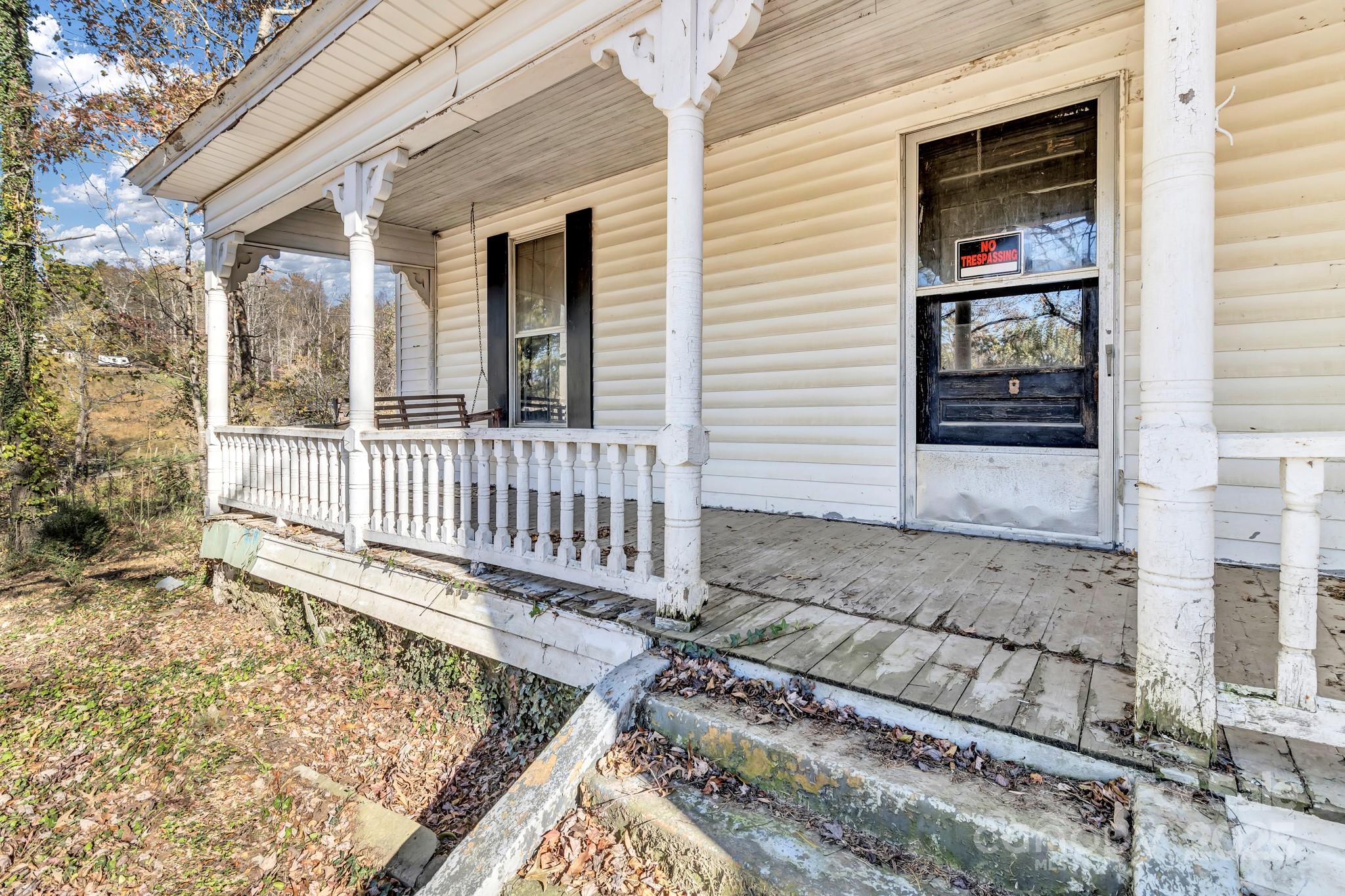 143 Sharon Road Fairview, NC 28730 - Photo 8 of 36 front view of a house with a porch
