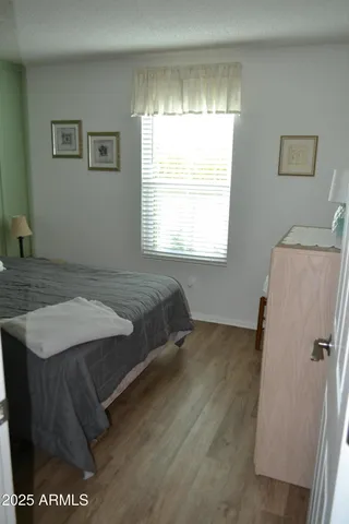 a room with a bed and a window