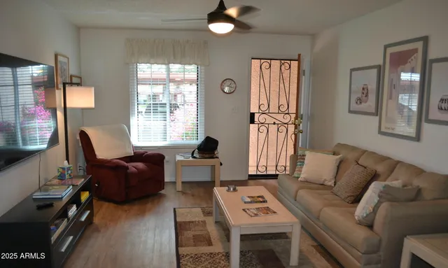 a living room with furniture and a flat screen tv