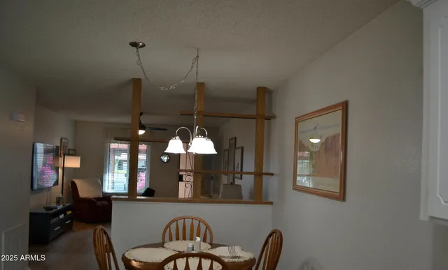 a dining room with furniture and window