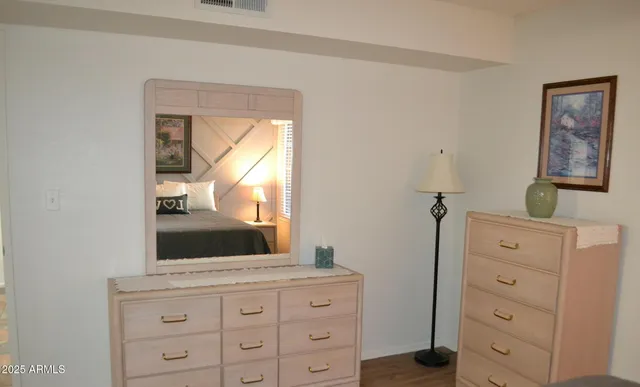 a bathroom with a sink a mirror and a window