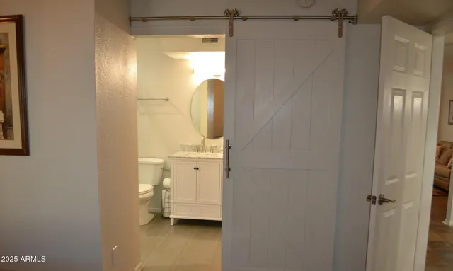a bathroom with a shower and a sink