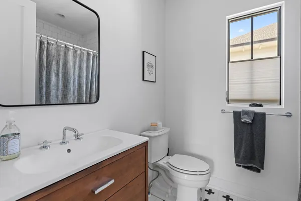 a kitchen with stainless steel appliances granite countertop a refrigerator a sink and a stove