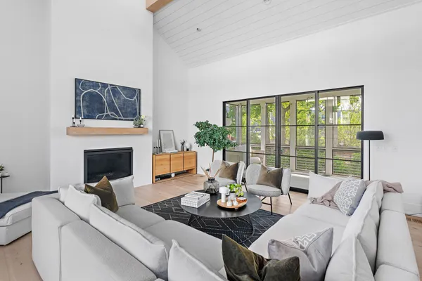 a living room with furniture and a large window