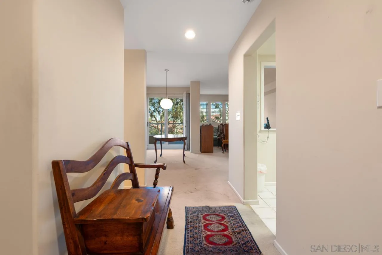 3890 Nobel Drive, Unit 302 San Diego, CA 92122 - Photo 2 of 16 a view of a hallway with chairs and a potted plant