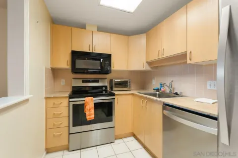 a kitchen with a stove and a microwave