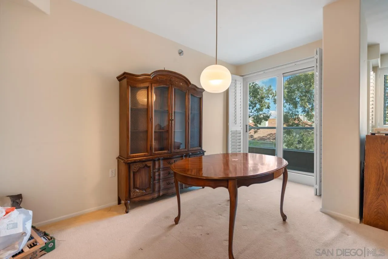 3890 Nobel Drive, Unit 302 San Diego, CA 92122 - Photo 4 of 16 a view of a livingroom with furniture and window