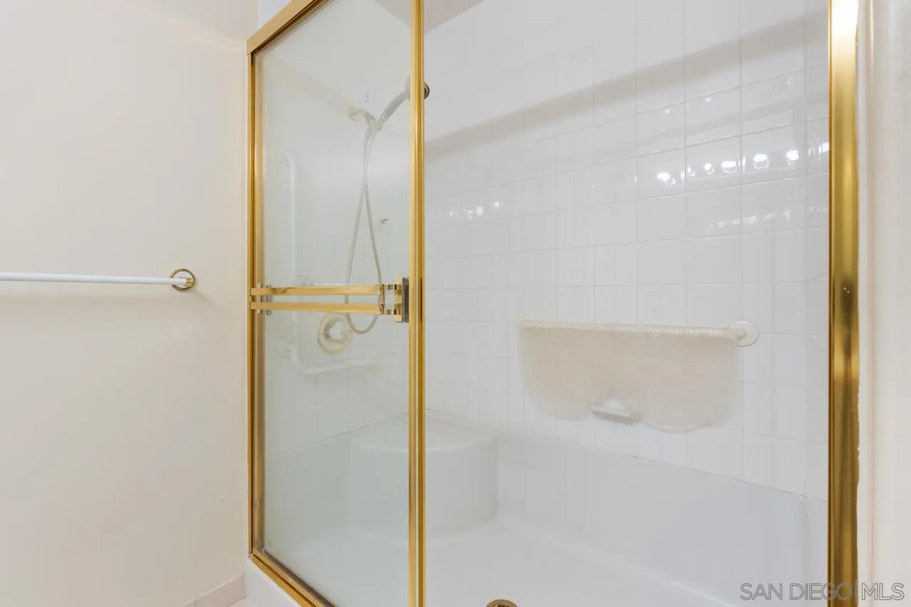3890 Nobel Drive, Unit 302 San Diego, CA 92122 - Photo 8 of 16 a bathroom with a glass shower door
