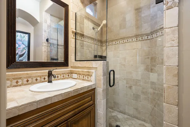 a bathroom with a sink and a mirror