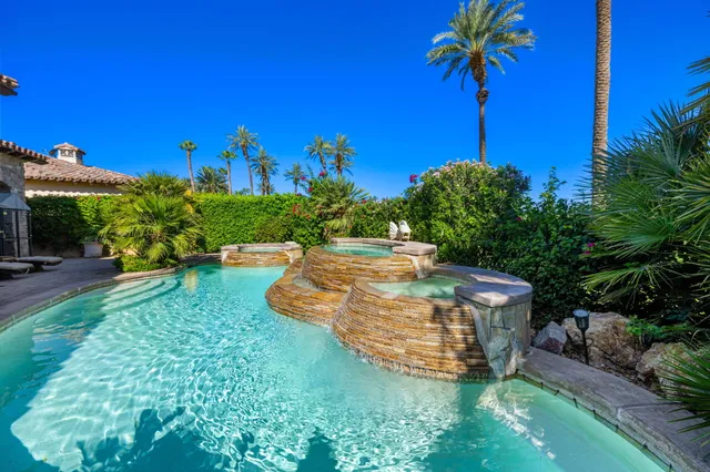 a view of a garden with a house