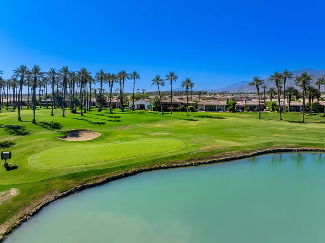 a view of a golf course with a lake