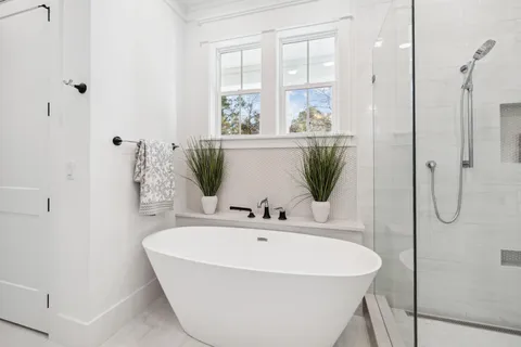 a kitchen with stainless steel appliances granite countertop a stove a sink dishwasher and a refrigerator with wooden floor