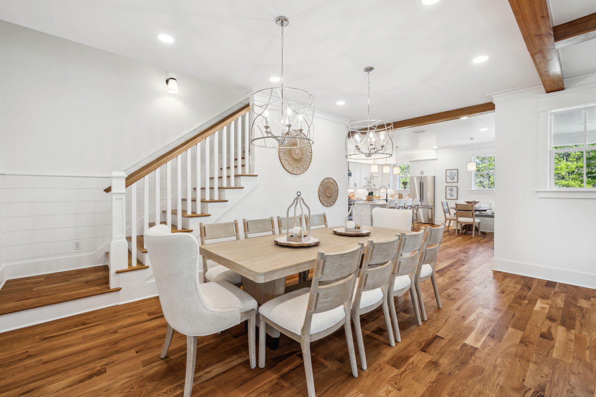 200 Grayton Boulevard Santa Rosa Beach, FL 32459 - Photo 5 of 55 a dining room with wooden floor a chandelier a wooden table and chairs