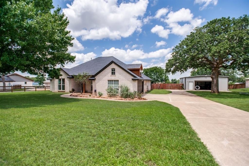 5643 West Caylor Road Fort Worth, TX 76244 - Photo 1 of 37 Light-colored brick exterior with dark trim and a dark shingle roof