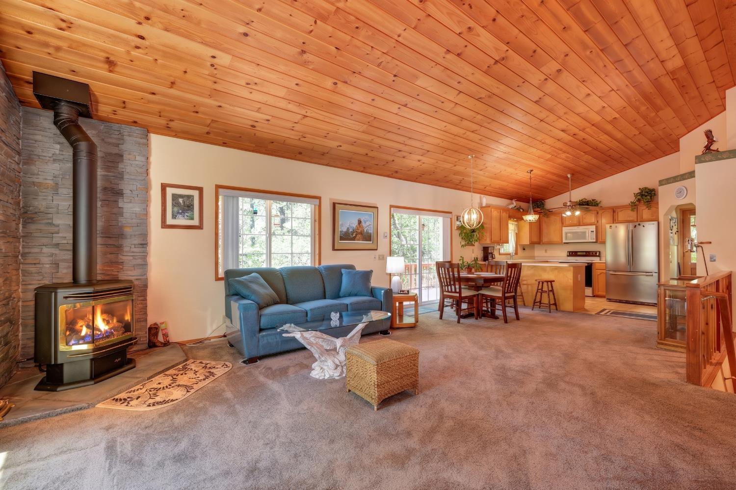 23998 Stable Road Sonora, CA 95370 - Photo 6 of 41 a living room with furniture and a fireplace