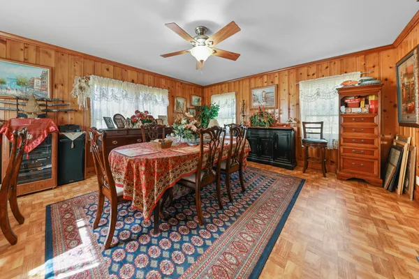 a view of a dining room with furniture window and outside view