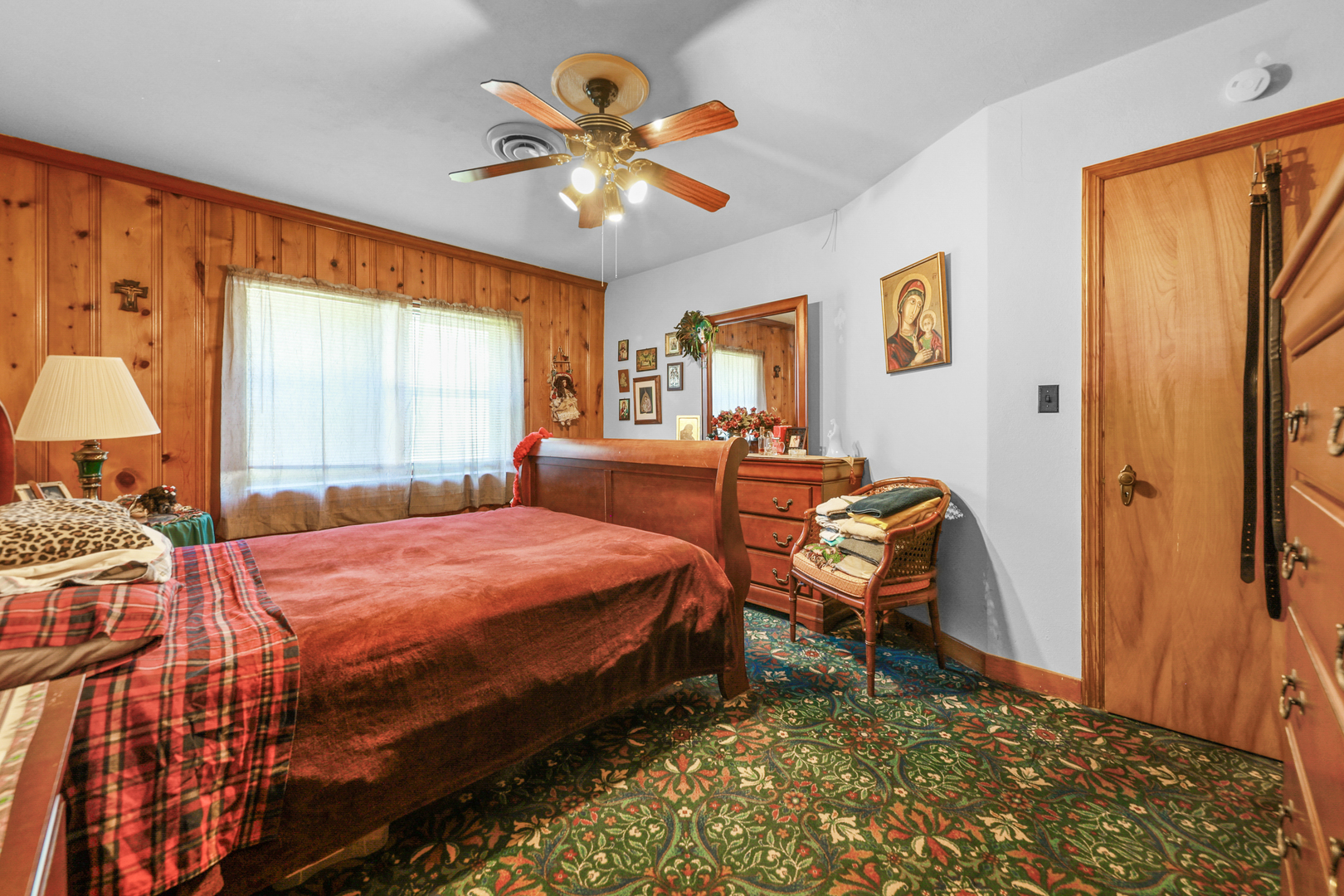 605 East Street Mazon, IL 60444 - Photo 10 of 28 a bedroom with a bed and a chandelier