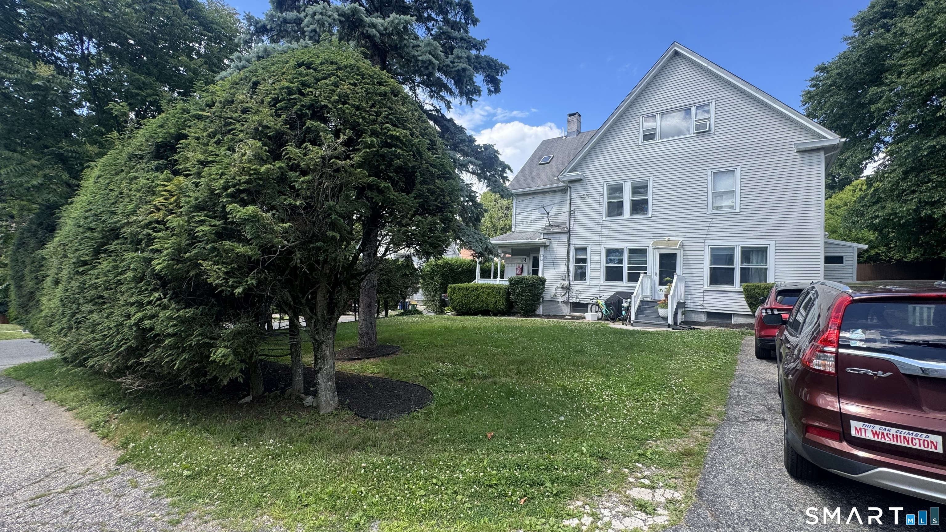 104 Prospect Street Ansonia, CT 06401 - Photo 6 of 40 a front view of a house with garden