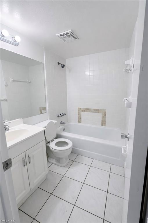 3325 Airport Road North, Unit R3 Naples, FL 34105 - Photo 3 of 5 a bathroom with a sink a toilet and shower