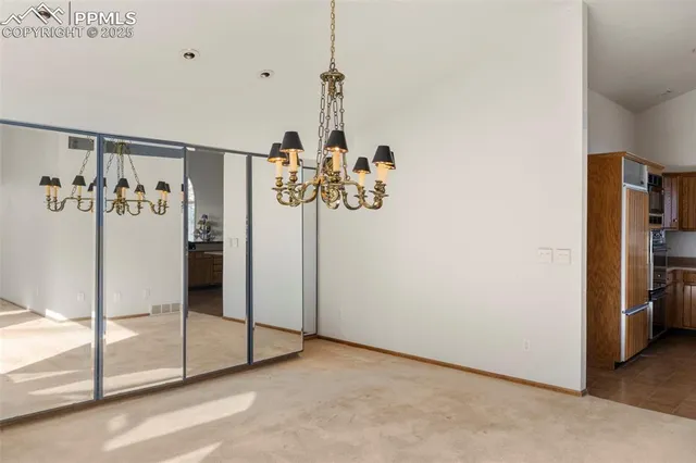 a view of a room with a flat screen tv