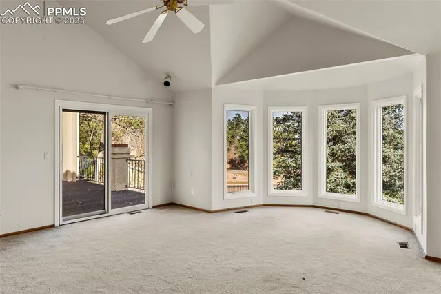 a view of an empty room with windows