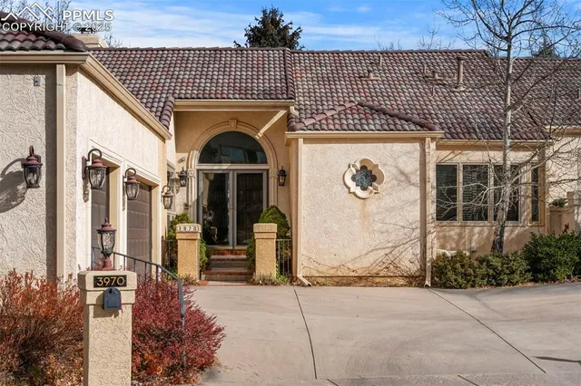 a front view of a house with parking
