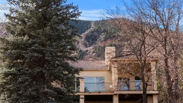 a building view with large trees
